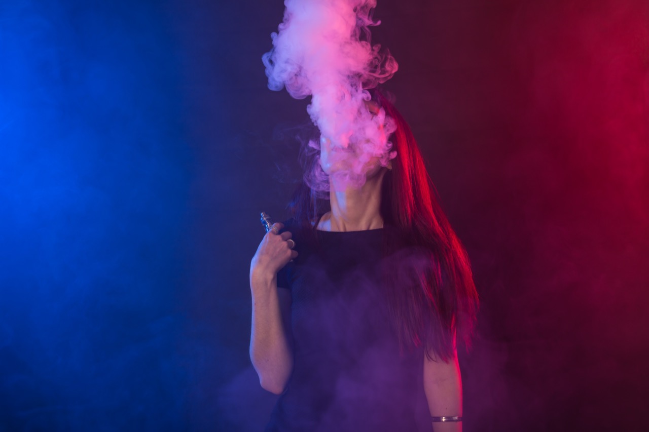 young-woman-in-black-t-shirt-vaping-in-red-and-blu-2025-02-24-11-17-18-utc.jpg