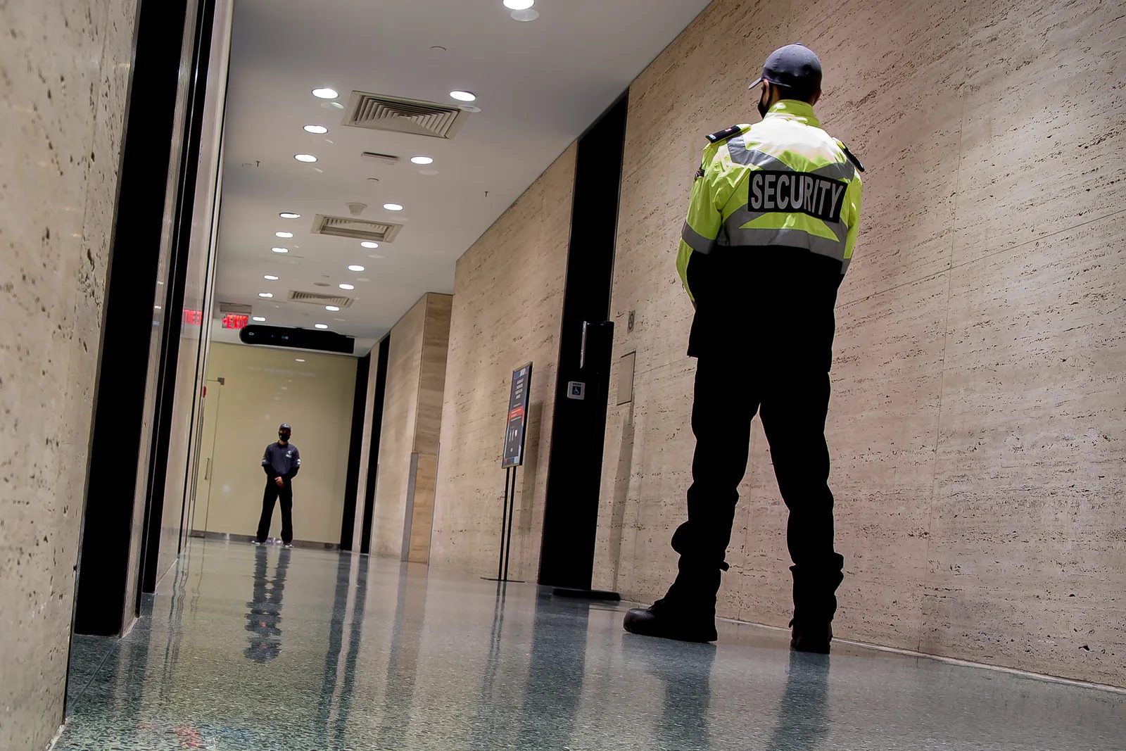 Security officer standing watch in a school hallway