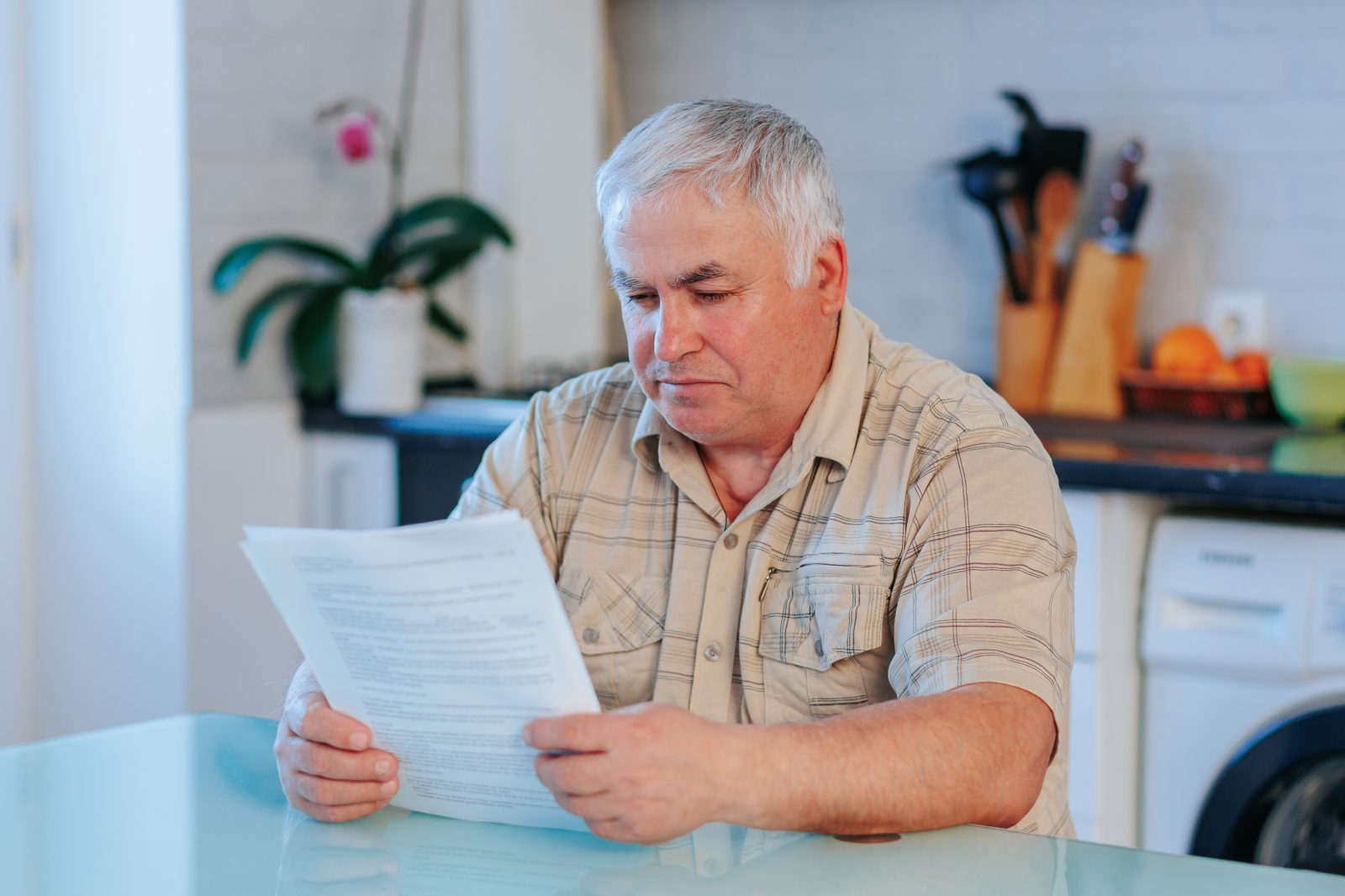 Parent reviewing a California juvenile court restitution order at a kitchen table