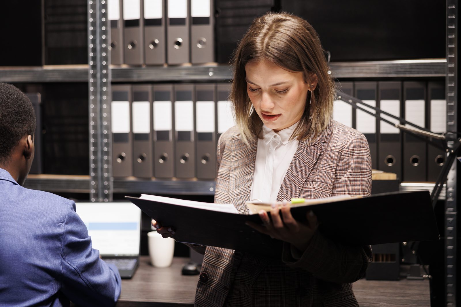 Juvenile defense attorney and immigration counsel reviewing a delinquency record together